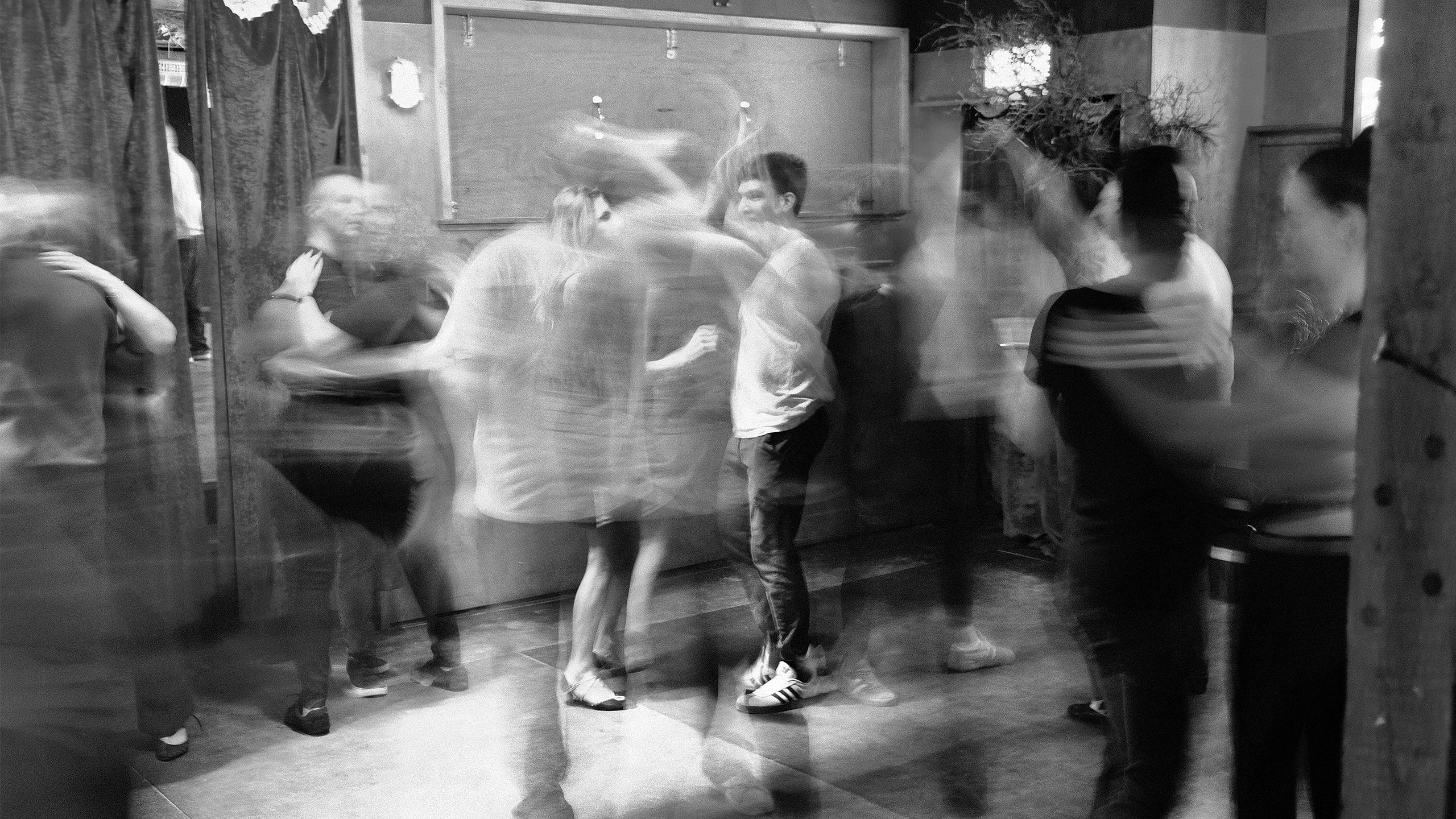 B&W image of dancers in a bar