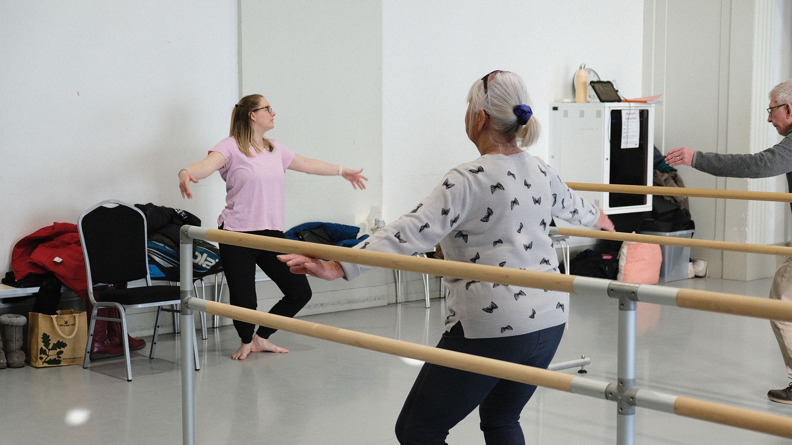 Aimee Hobbs (dance teacher) and attendee bending knees in Plie