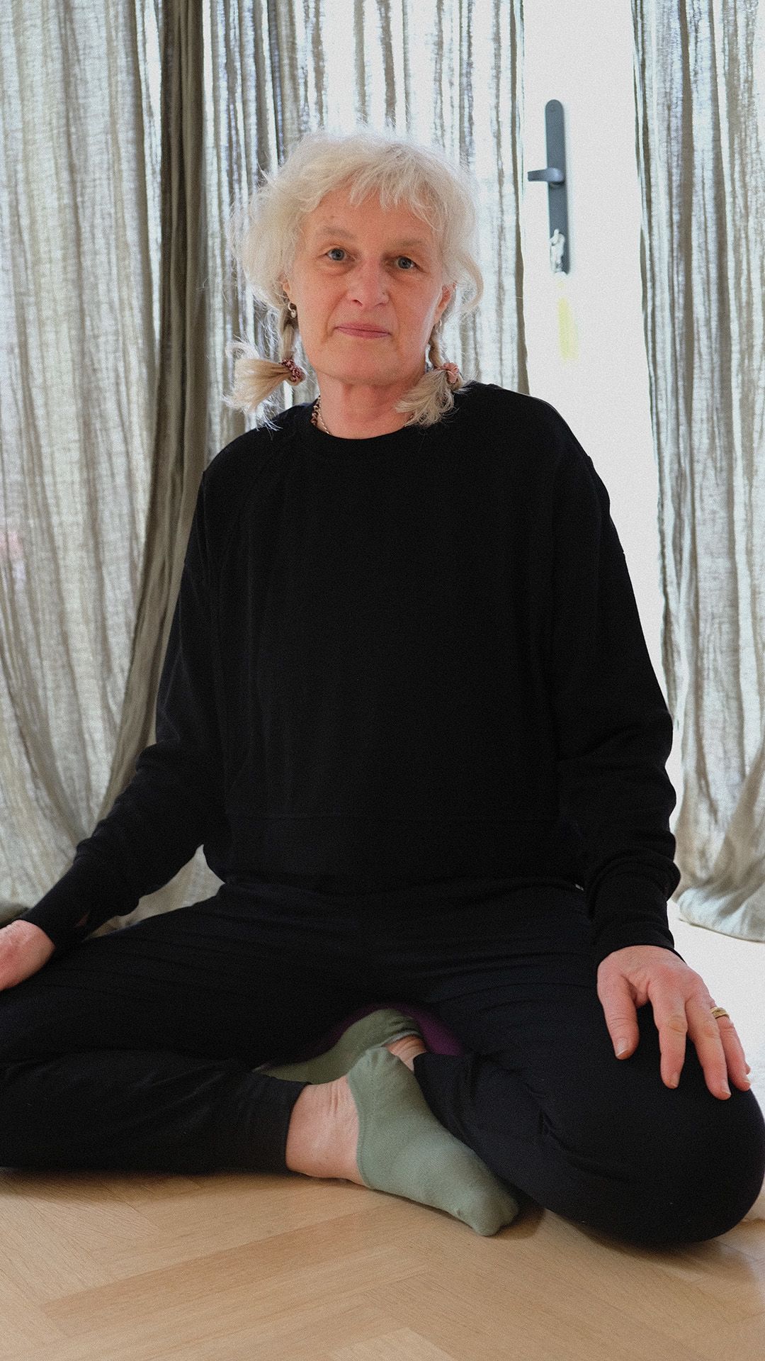 Sue Rush sat crosslegged in her yoga studio